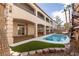 Relaxing backyard with a refreshing pool, manicured landscaping, and a covered patio area at 7616 Gossamer Wind St, Las Vegas, NV 89139