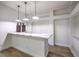 Modern bar area featuring a marble countertop and sleek pendant lighting at 7616 Gossamer Wind St, Las Vegas, NV 89139