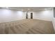 Huge basement area, carpeted with stairwell and recessed lighting at 7616 Gossamer Wind St, Las Vegas, NV 89139