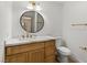 Well-lit bathroom featuring a marble countertop, modern fixtures, and ample storage, creating a comfortable and stylish space at 7616 Gossamer Wind St, Las Vegas, NV 89139