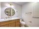 Bathroom featuring modern vanity, round mirror, and updated fixtures at 7616 Gossamer Wind St, Las Vegas, NV 89139