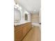 Modern bathroom with double sinks, white countertops, and gold hardware at 7616 Gossamer Wind St, Las Vegas, NV 89139