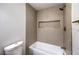 Contemporary bathroom with tile shower, tub, and gold fixtures at 7616 Gossamer Wind St, Las Vegas, NV 89139
