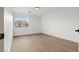 This bedroom features hardwood floors and a window for natural light at 7616 Gossamer Wind St, Las Vegas, NV 89139