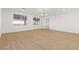 Spacious bedroom featuring bright light, neutral walls, and light hardwood flooring at 7616 Gossamer Wind St, Las Vegas, NV 89139