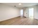 Bright bedroom featuring wood floors, white walls, and a closet at 7616 Gossamer Wind St, Las Vegas, NV 89139