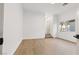 Bright bedroom with light wood flooring and a window view of palm trees at 7616 Gossamer Wind St, Las Vegas, NV 89139