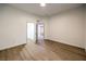 Spacious bedroom featuring wood floors, white walls, and a closet at 7616 Gossamer Wind St, Las Vegas, NV 89139
