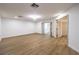 This room features wood flooring and multiple doorways providing easy access to other areas at 7616 Gossamer Wind St, Las Vegas, NV 89139