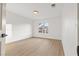 This bedroom features natural light and hardwood flooring at 7616 Gossamer Wind St, Las Vegas, NV 89139