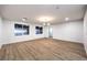 This spacious bedroom features wood flooring and large windows that provide plenty of natural light at 7616 Gossamer Wind St, Las Vegas, NV 89139