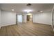 Bedroom with wood flooring and open doorways offering a view of the ensuite bathroom at 7616 Gossamer Wind St, Las Vegas, NV 89139