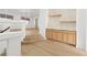 The dining area offers modern cabinetry and wood flooring at 7616 Gossamer Wind St, Las Vegas, NV 89139