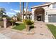 Beautiful home with a stone pathway, manicured lawn, mature trees, and well-maintained landscaping at 7616 Gossamer Wind St, Las Vegas, NV 89139