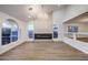 Bright and airy living room with high ceilings, modern lighting, and a cozy fireplace at 7616 Gossamer Wind St, Las Vegas, NV 89139