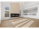 Bright living room boasting a modern fireplace, tall ceilings, and beautiful natural light at 7616 Gossamer Wind St, Las Vegas, NV 89139