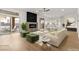 Cozy living room featuring a fireplace, neutral decor, and sliding door at 7616 Gossamer Wind St, Las Vegas, NV 89139