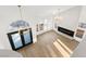 Bright and airy living room with hardwood floors and large windows for natural light at 7616 Gossamer Wind St, Las Vegas, NV 89139