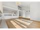 Spacious living room featuring tall ceilings, modern lighting, and light wood flooring at 7616 Gossamer Wind St, Las Vegas, NV 89139