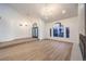 Bright living room featuring hardwood floors and modern lighting fixtures at 7616 Gossamer Wind St, Las Vegas, NV 89139