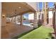 Spacious covered patio area with a ceiling fan, overlooking a swimming pool and landscaped backyard at 7616 Gossamer Wind St, Las Vegas, NV 89139