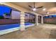 Outdoor covered patio with ceiling fans and pool view at 7616 Gossamer Wind St, Las Vegas, NV 89139