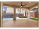 Covered patio offers a seamless transition to the pool and backyard, ideal for outdoor living at 7616 Gossamer Wind St, Las Vegas, NV 89139