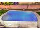 Inviting backyard pool with baja step and mature landscaping at 7616 Gossamer Wind St, Las Vegas, NV 89139
