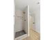 Modern shower with tiled walls, mosaic floor, and gold accents, providing a luxurious spa-like experience at 7616 Gossamer Wind St, Las Vegas, NV 89139