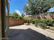 Backyard featuring a concrete patio and landscaped planters at 7733 Donner Peak St, Las Vegas, NV 89166