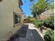 Cozy backyard area with a garden and a view of the neighbor's house at 7733 Donner Peak St, Las Vegas, NV 89166