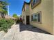 Backyard featuring a concrete patio and landscaped planters at 7733 Donner Peak St, Las Vegas, NV 89166
