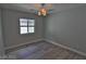 Bright bedroom with a ceiling fan and a window that allows natural light at 7733 Donner Peak St, Las Vegas, NV 89166