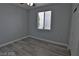 Cozy bedroom with neutral paint, and wood look flooring at 7733 Donner Peak St, Las Vegas, NV 89166