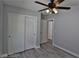 Bright bedroom with a ceiling fan and closet space at 7733 Donner Peak St, Las Vegas, NV 89166