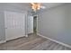 Bright bedroom with a ceiling fan and closet space at 7733 Donner Peak St, Las Vegas, NV 89166