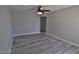 Bedroom with wood-look flooring and a ceiling fan at 7733 Donner Peak St, Las Vegas, NV 89166