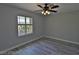 Comfortable bedroom with a ceiling fan and a bright window at 7733 Donner Peak St, Las Vegas, NV 89166