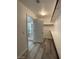 Spacious walk-in closet with custom shelving and adjacent bathroom at 7733 Donner Peak St, Las Vegas, NV 89166