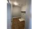 The laundry room features tile floors and a shelf for storage at 7733 Donner Peak St, Las Vegas, NV 89166