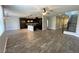 Open floor plan featuring tile flooring, a kitchen island, and recessed lighting at 7733 Donner Peak St, Las Vegas, NV 89166