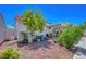 Backyard area with gravel landscaping and a covered patio is perfect for adding your own personal touch at 7874 Trail Boss Ct, Las Vegas, NV 89113