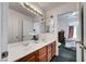 Bright bathroom featuring a dual sink vanity with convenient access to the bedroom at 7874 Trail Boss Ct, Las Vegas, NV 89113