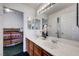 Bright bathroom featuring a dual sink vanity with convenient access to the bedroom at 7874 Trail Boss Ct, Las Vegas, NV 89113