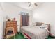 Comfortable bedroom featuring natural light, ceiling fan, and an ideal relaxation space at 7874 Trail Boss Ct, Las Vegas, NV 89113