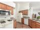 Well-lit kitchen with wooden cabinets, granite countertops and modern appliances at 7874 Trail Boss Ct, Las Vegas, NV 89113