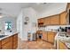 A kitchen featuring wood cabinets, tile floors, and countertops at 7874 Trail Boss Ct, Las Vegas, NV 89113