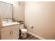Bathroom featuring a white sink, a toilet, and wood-look floors at 8324 W Charleston Blvd # 1036, Las Vegas, NV 89117