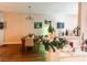 Dining area featuring table set for six with neutral wall art and open to the kitchen at 8324 W Charleston Blvd # 1036, Las Vegas, NV 89117