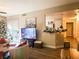 Open concept living area with a fireplace and sliding doors to an outdoor space at 8324 W Charleston Blvd # 1036, Las Vegas, NV 89117